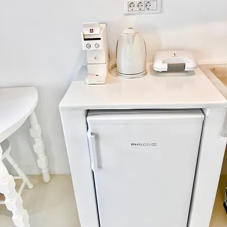 Aphrodite Next To The Windmills Of Mykonos