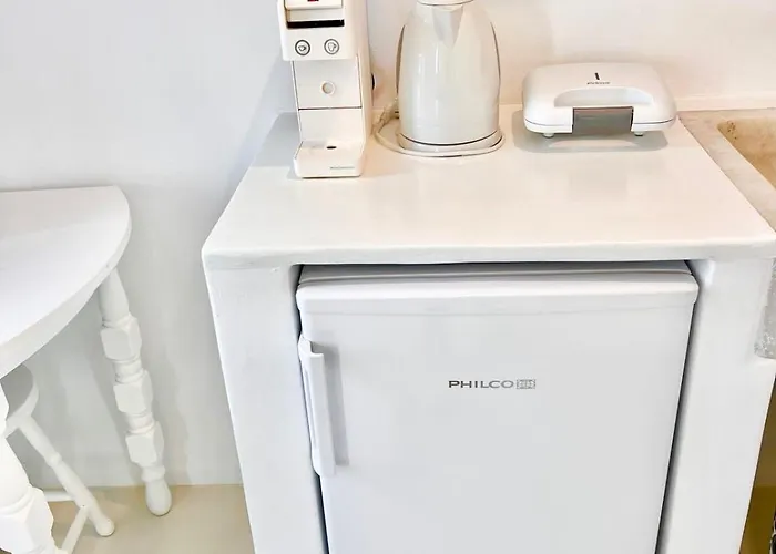 Aphrodite Next To The Windmills Of Mykonos