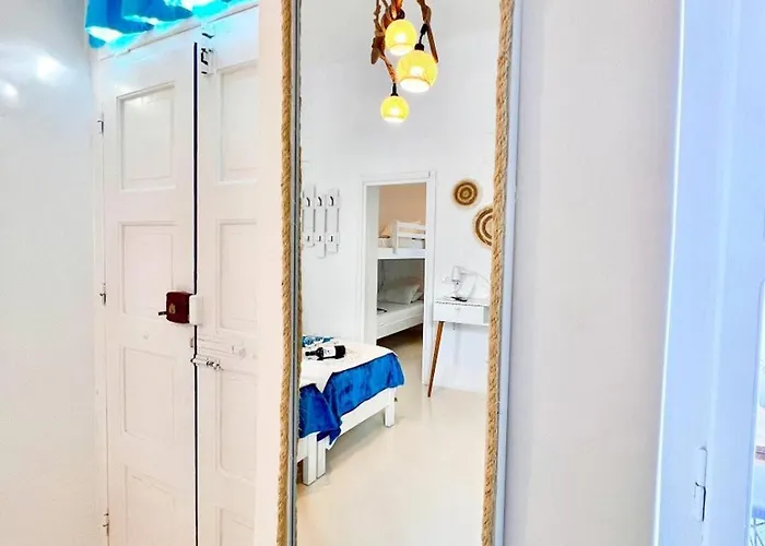 Aphrodite Next To The Windmills Of Mykonos